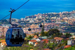 Funchal with traditional cable car above the city