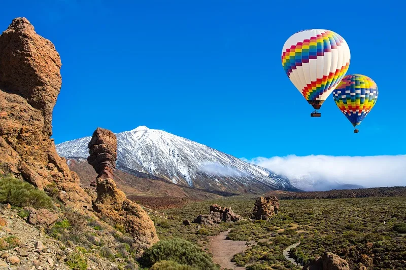 Beautiful view of unique Roque Cinchado unique rock formation with famous volcano Teide in the background on Teide National Park, Tenerife, Canary Islands, Spain